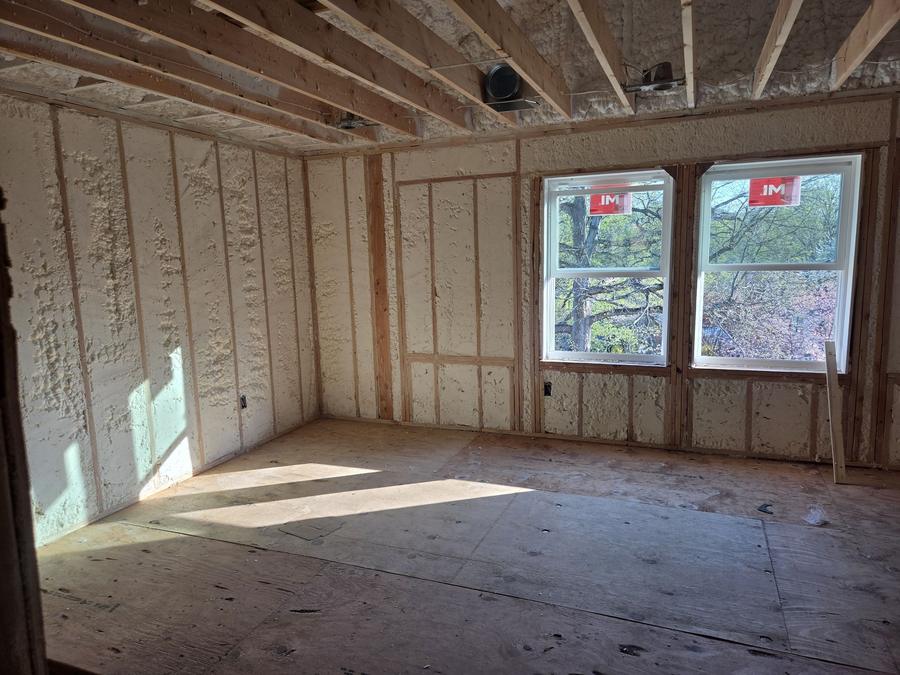 Spray foam filling the exterior walls of a sunlit room, Mahopac, NY