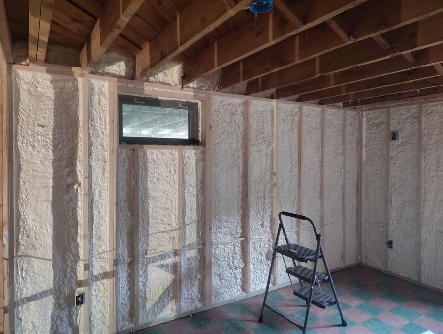 Spray foam around a basement window, Meriden, CT
