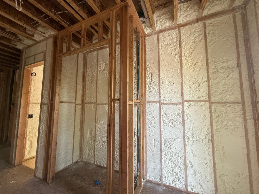 Spray foam filling the wall cavities between studs, Larchmont, NY