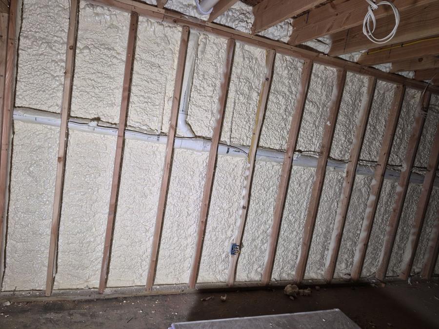 Spray foam filling the wall cavities, West Islip, NY