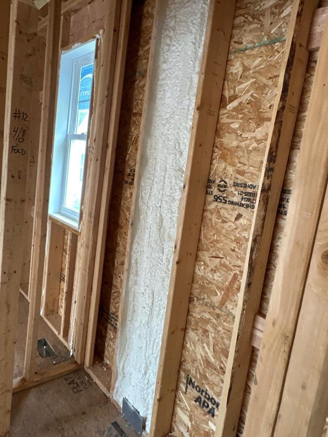 Foamed wall bay beside a window in a framed room, Simsbury, CT