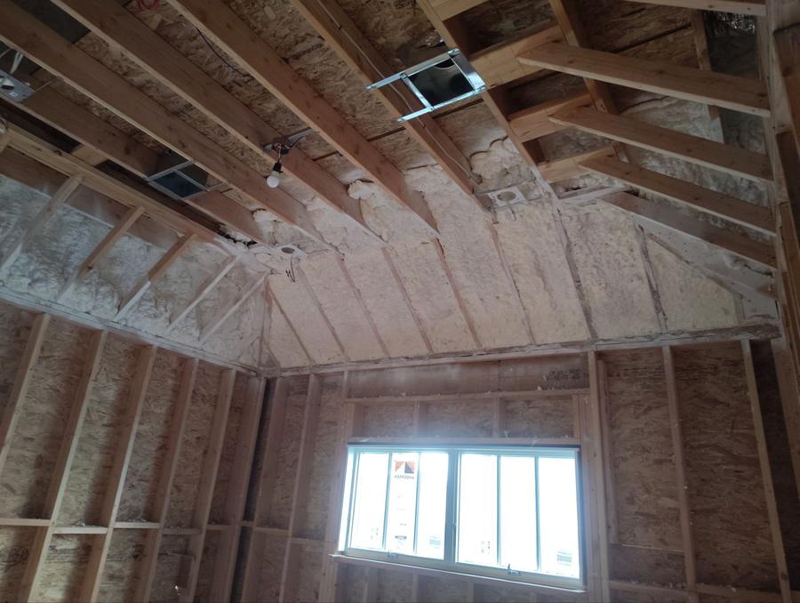 Spray foam sprayed between the rafters of a vaulted ceiling, Scarsdale, NY