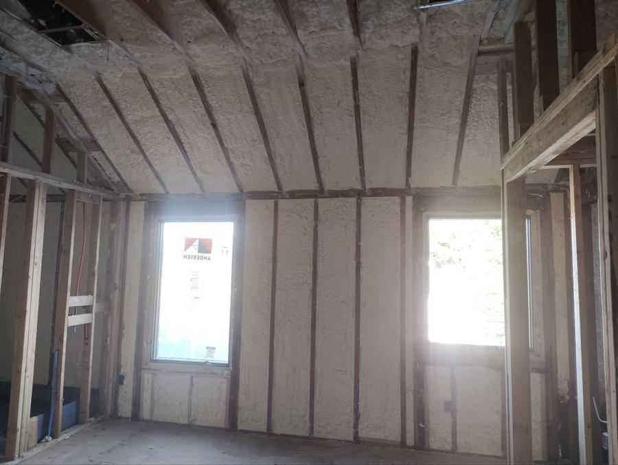Spray foam across the ceiling and walls between two windows, Cresskill, NJ