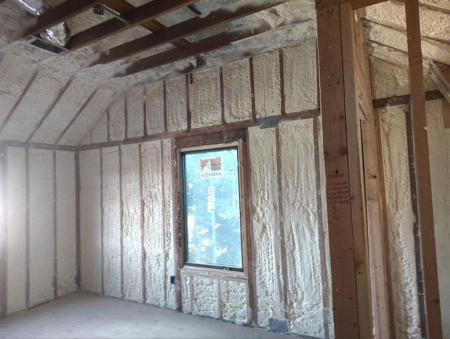Spray foam covering the walls and sloped ceiling of an upstairs room, Cresskill, NJ