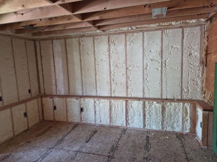 Spray foam filling the wall cavities of a new addition, North Branford, CT