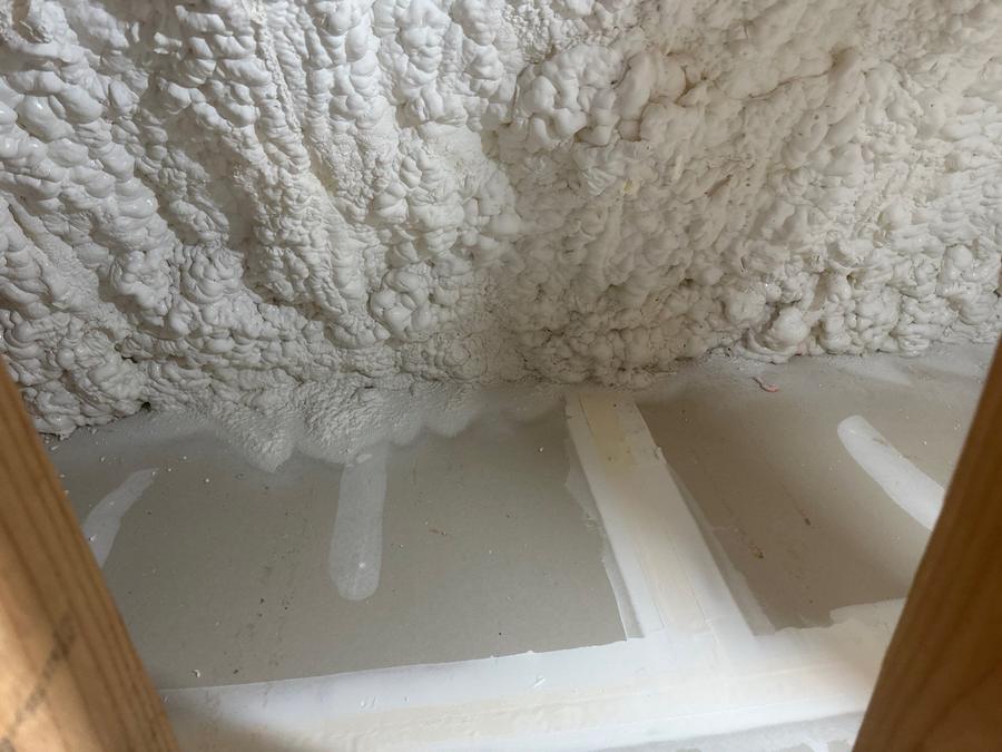 Open-cell foam sprayed down to meet the drywall between framing, Port Chester, NY