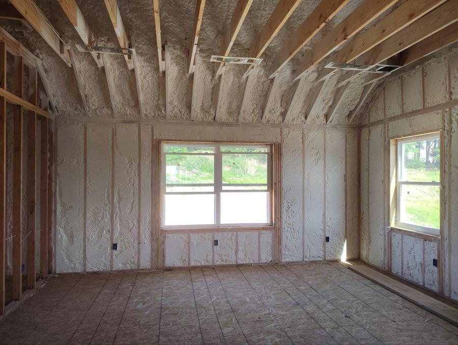 Foamed walls and ceiling rafters in a framed room, Lagrangeville, NY