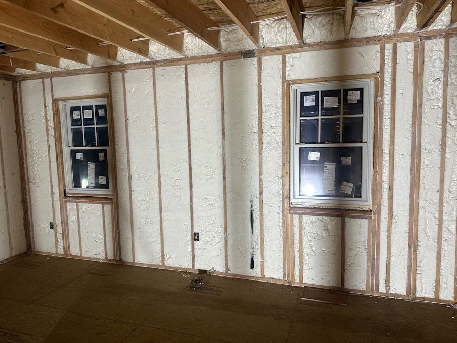 Open-cell foam filling the wall cavities around two windows, Larchmont, NY