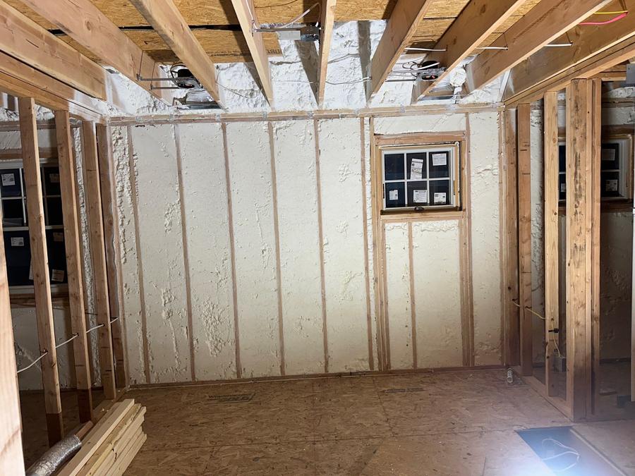 Spray foam covering a framed wall below the ceiling joists, Larchmont, NY