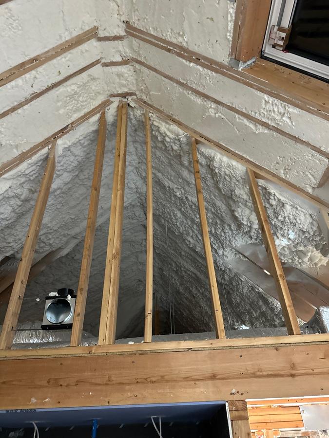 Foam sprayed between the rafters of a gable ceiling, Larchmont, NY