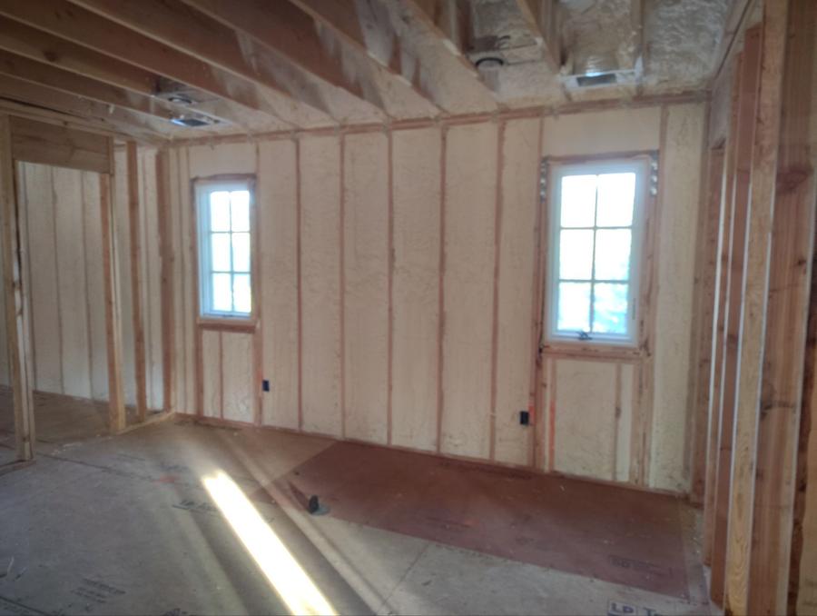 Open-cell foam filling the wall cavities between two windows, Glen Head, NY