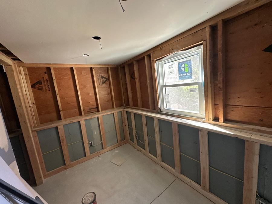 Before: open wall framing with rigid board at the bottom, Danbury, CT