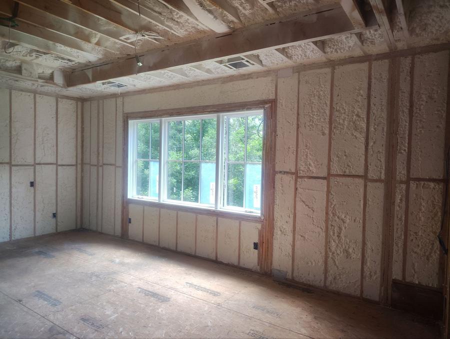 Spray foam covering the exterior walls around a wide window, Katonah, NY