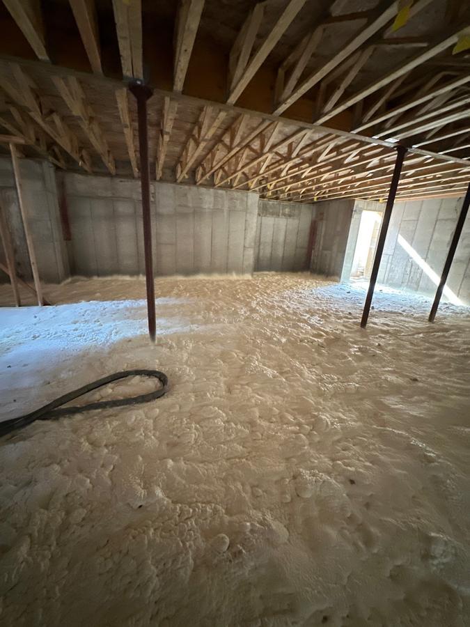 Spray foam spread across the open basement floor, Brewster, NY