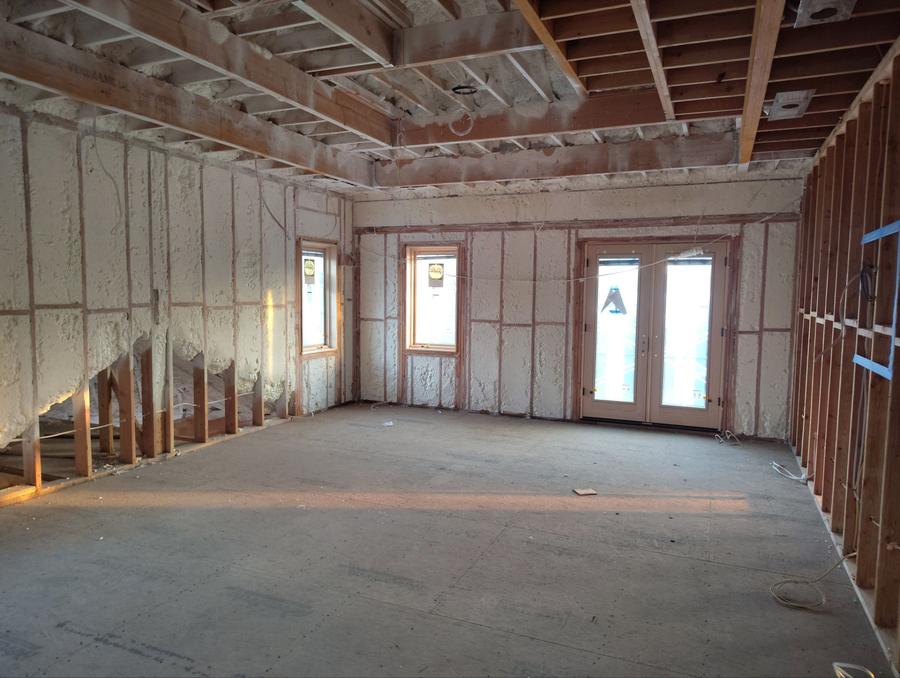 Spray foam filling the wall cavities around windows and doors, Kings Point, NY