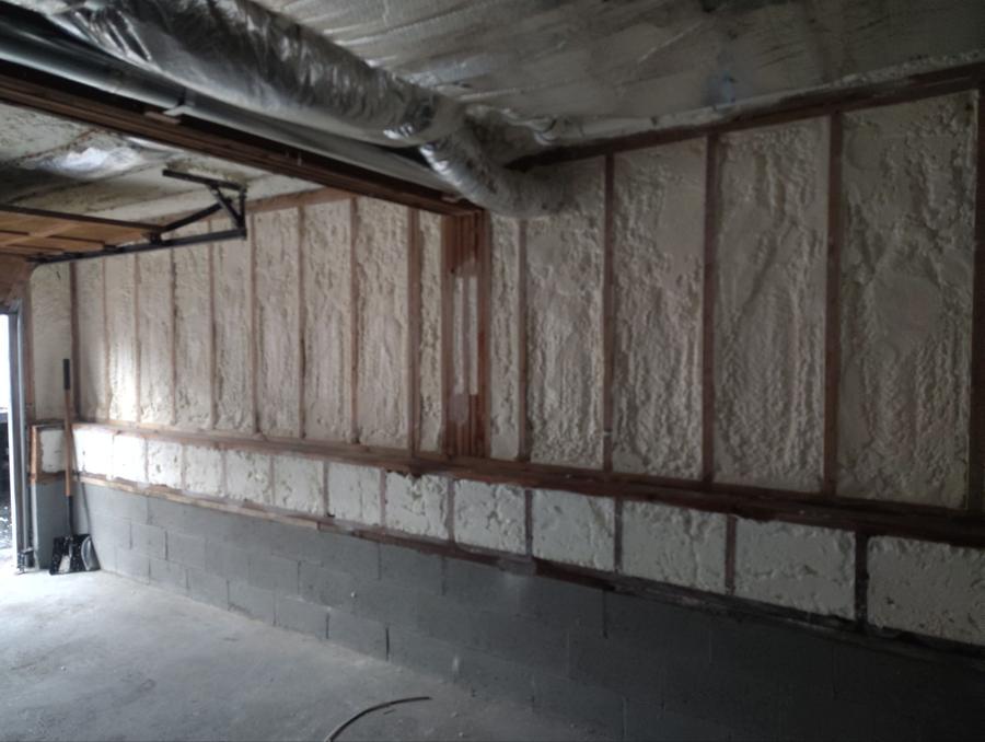 Lower-level wall cavities and band area filled with spray foam, Fairfield, CT