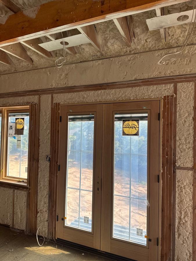 Foamed walls and header area around a pair of doors, Kings Point, NY