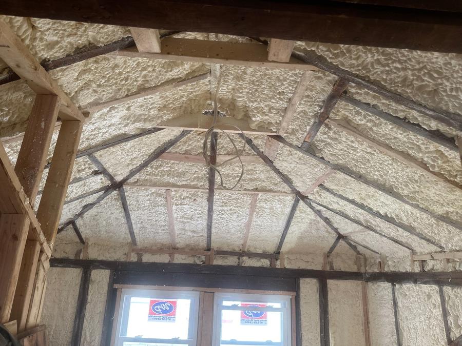 Spray foam covering the roof deck and gable wall around the attic windows, Englewood, NJ