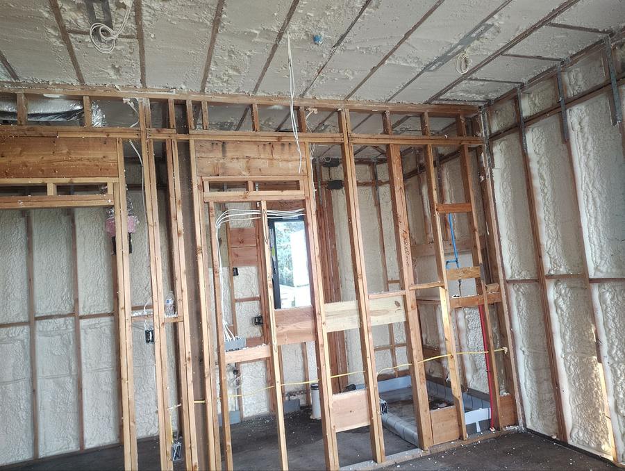 Spray foam filling the exterior wall bays and ceiling of a framed room, Cliffside Park, NJ