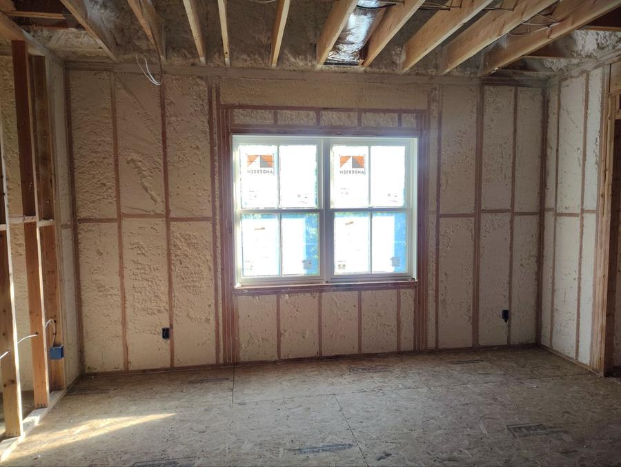 Spray foam insulating the exterior walls of a bedroom, Chappaqua, NY