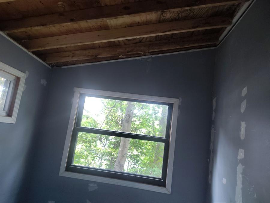 Before: bare ceiling boards exposed above the room, Portland, CT