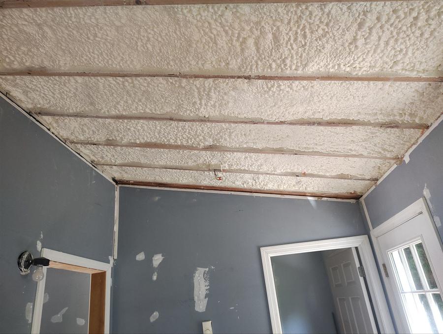 Spray foam filling the ceiling bays of a second room, Portland, CT