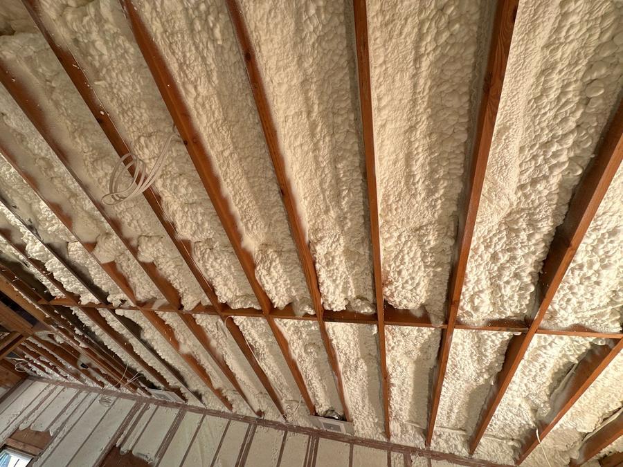 Spray foam filling the ceiling rafter bays, Water Mill, NY