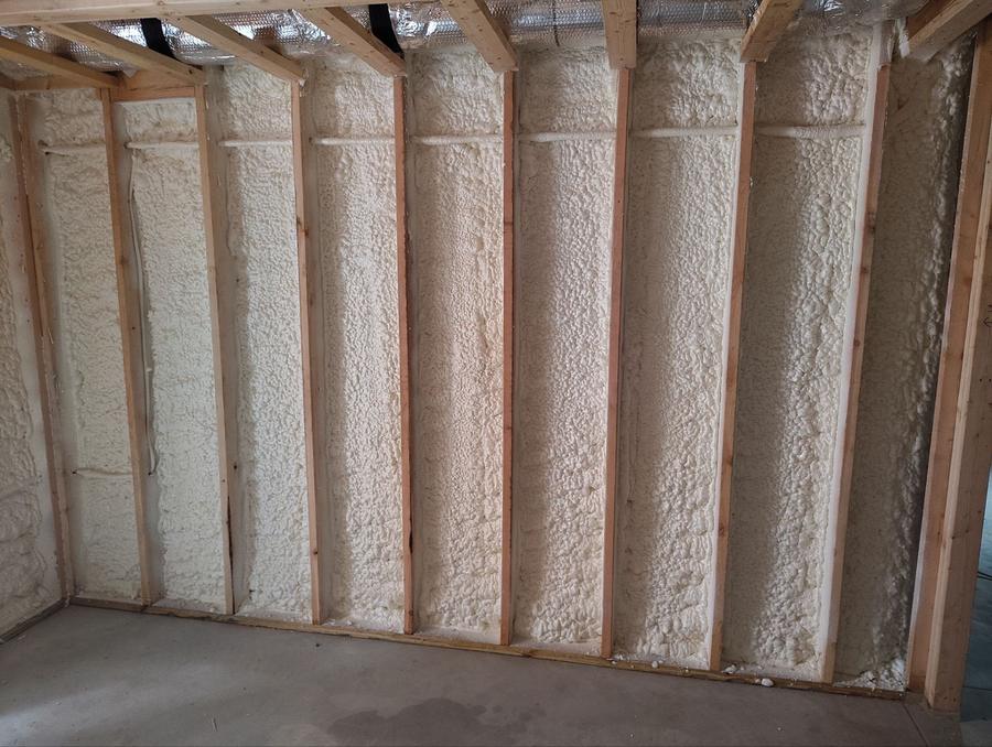 Spray foam across a full run of framed wall bays, Old Saybrook, CT