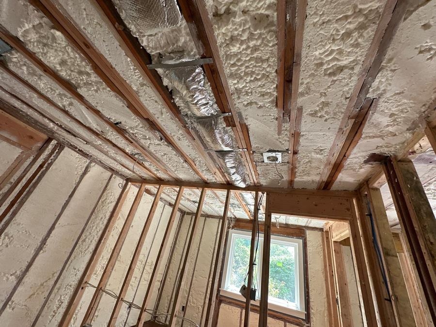 Foamed ceiling bays between the joists with ductwork in place, Rye, NY
