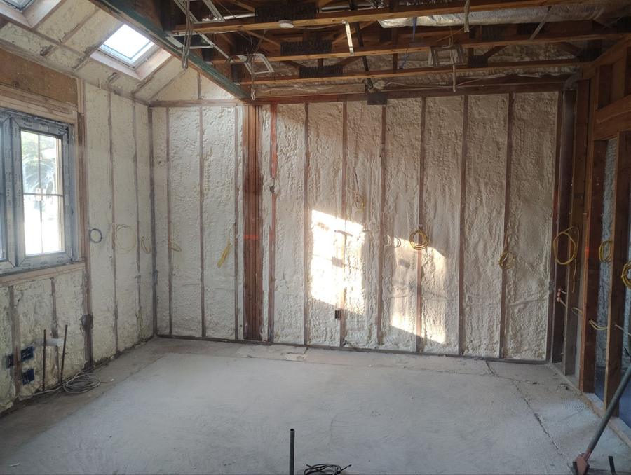 Spray foam filling the walls beneath a skylit ceiling, Piscataway, NJ