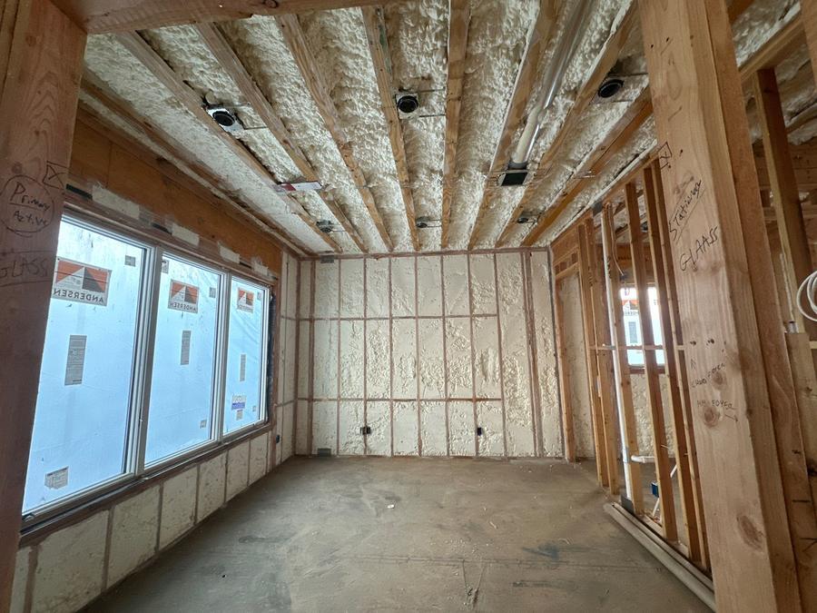 Spray foam on the ceiling and walls of a window-lined room, Tenafly, NJ