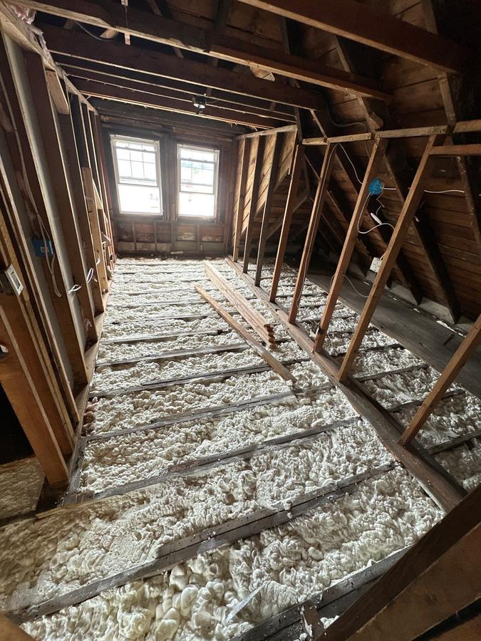 Loose-fill insulation between the floor joists of an open attic, Wallington, NJ