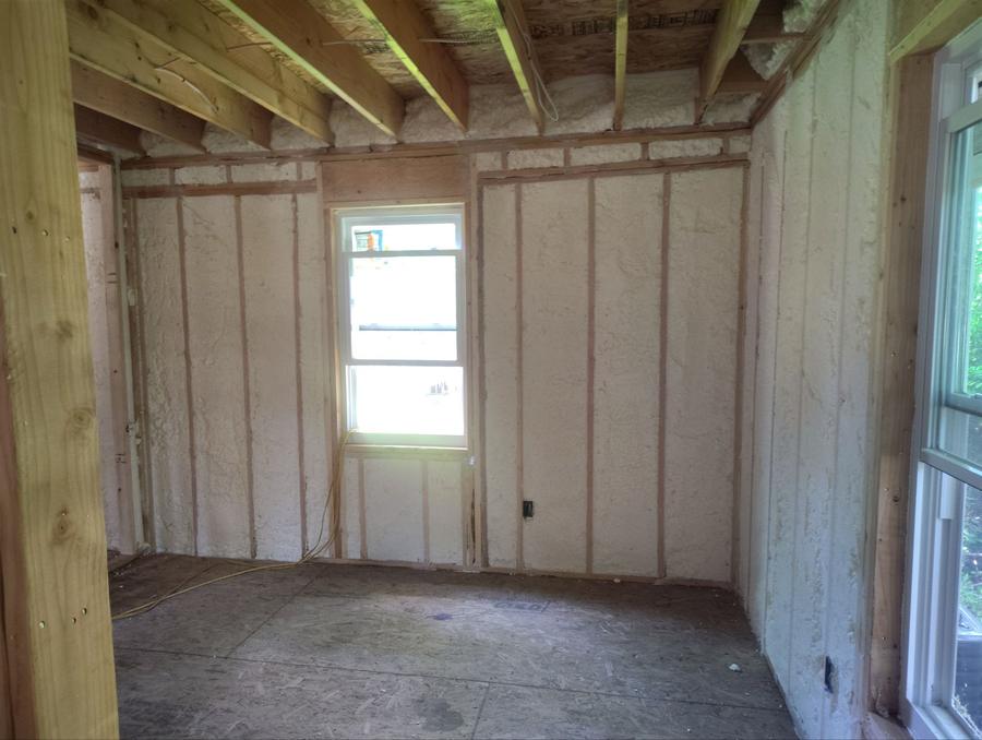 Spray foam filling the wall cavities around a window, Ossining, NY