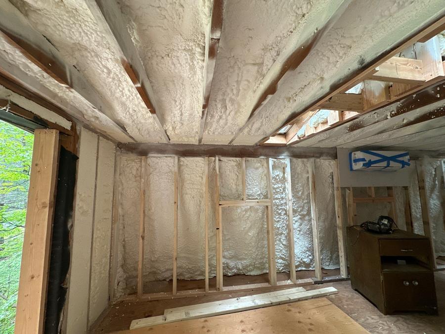 Spray foam across the sloped ceiling and end wall, Cortlandt Manor, NY