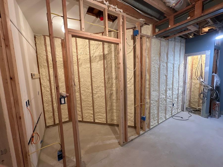 Spray foam filling the framed basement walls, White Plains, NY