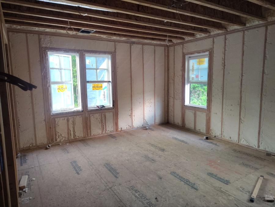 Spray foam filling the exterior walls of an upper room, Harrison, NY