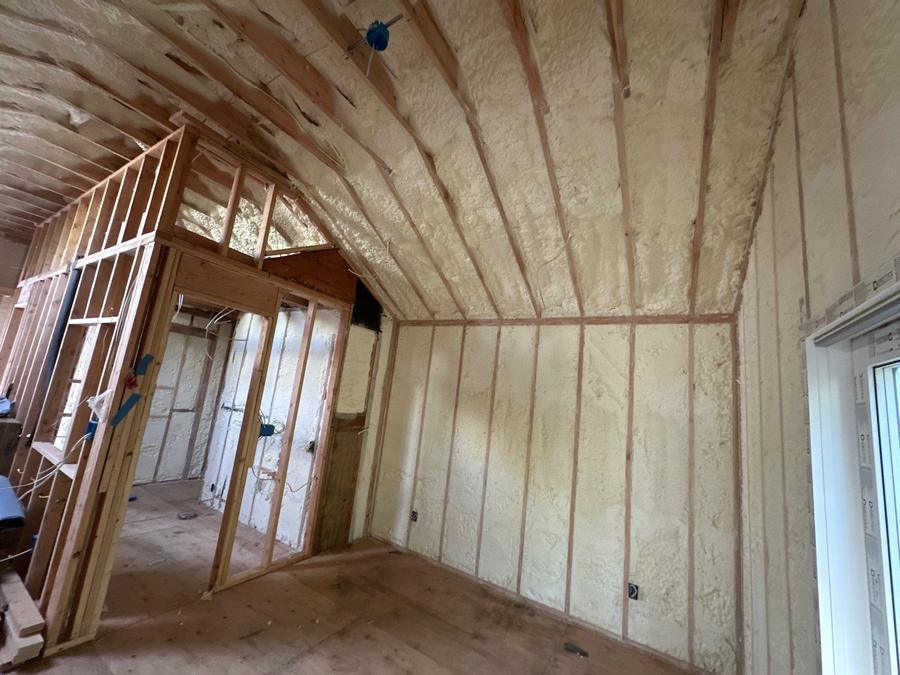 Spray foam across a curved vaulted ceiling and side walls, Centerport, NY