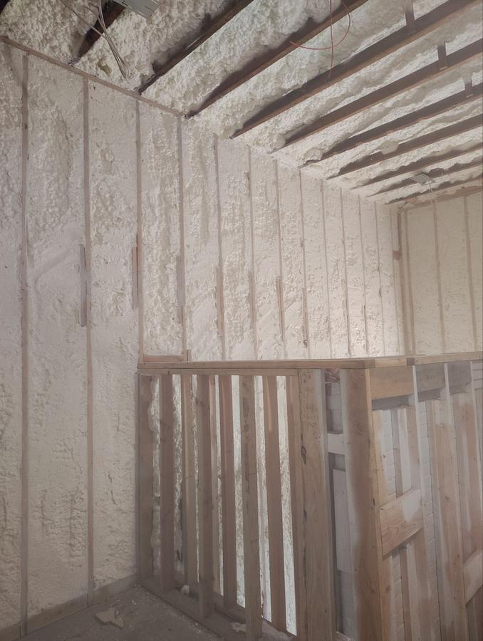Spray foam filling the stairwell walls and ceiling bays, Plymouth, CT