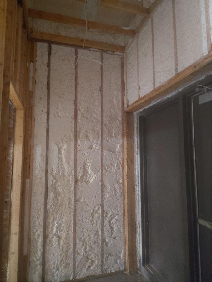 Spray foam in the wall bays beside a doorway, Plymouth, CT