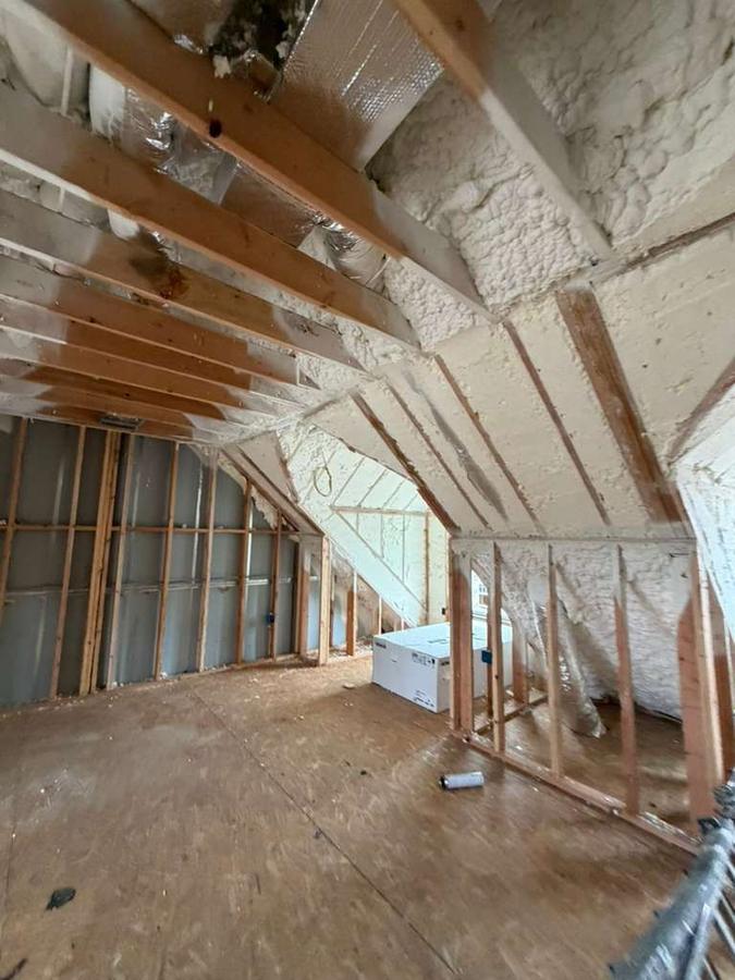 Foamed rafter bays and knee wall in the upper level, Stamford, CT