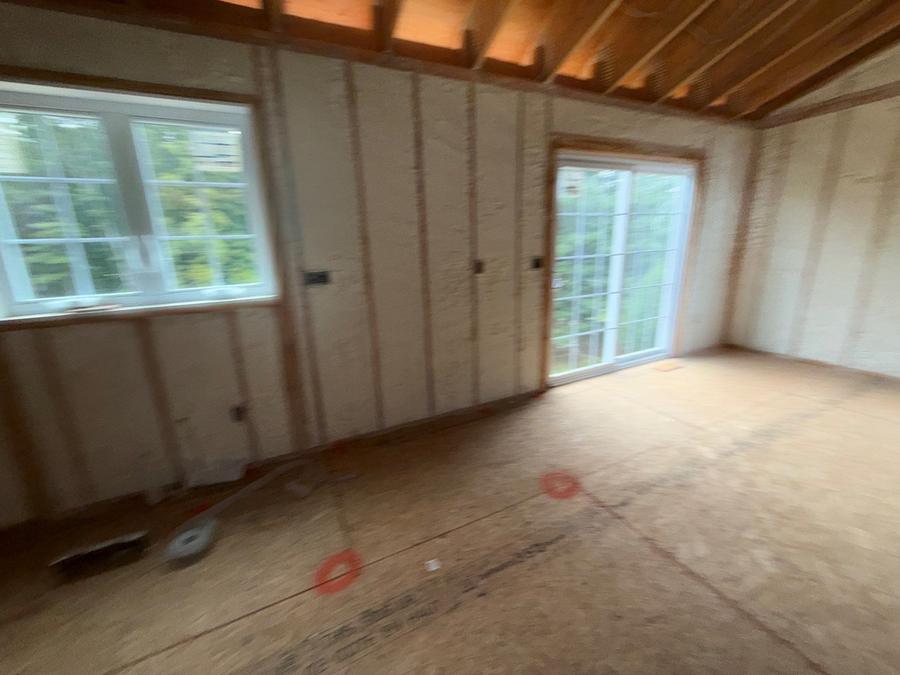 Insulated stud bays running past a bank of windows, Colchester, CT