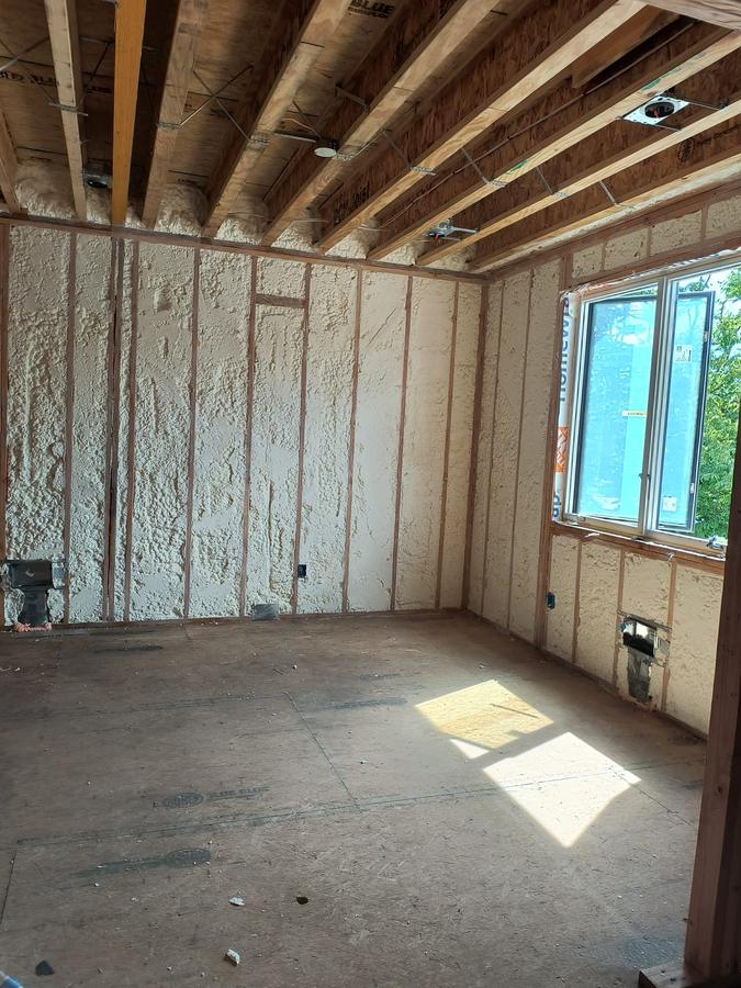 Finished spray foam walls around a window, Clifton, NJ