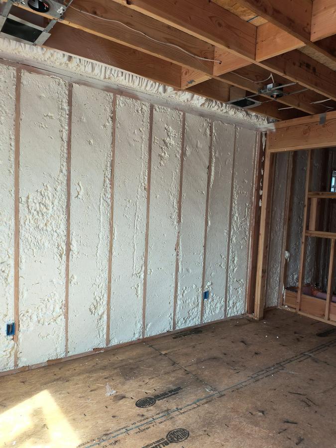 Spray foam filling every stud bay of an exterior wall, Clifton, NJ