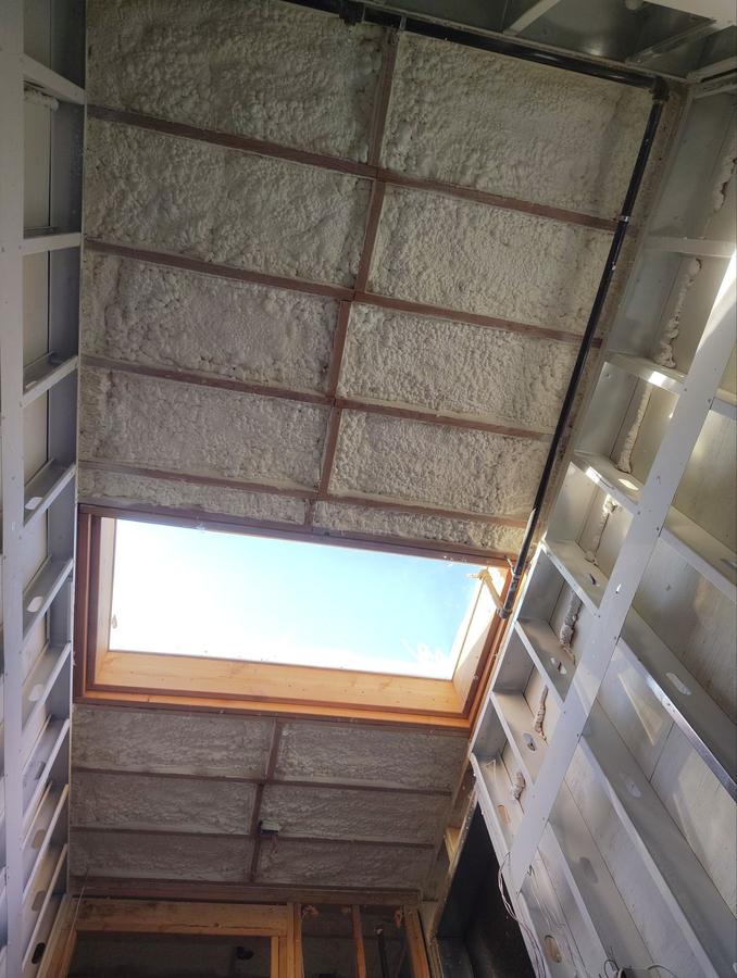 Spray foam on the ceiling around a skylight, Hoboken, NJ