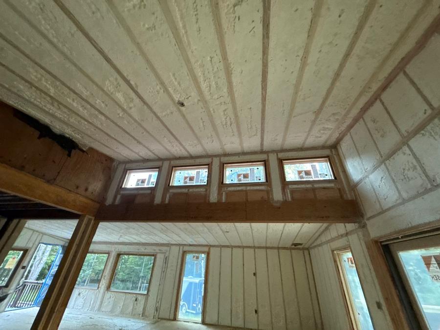 Foamed walls and sloped ceiling above a run of windows, Saugerties, NY