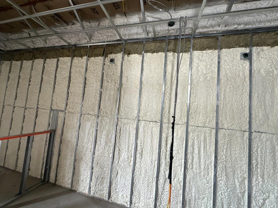 Spray foam filling the bays of a steel-framed wall, Ridgefield, CT